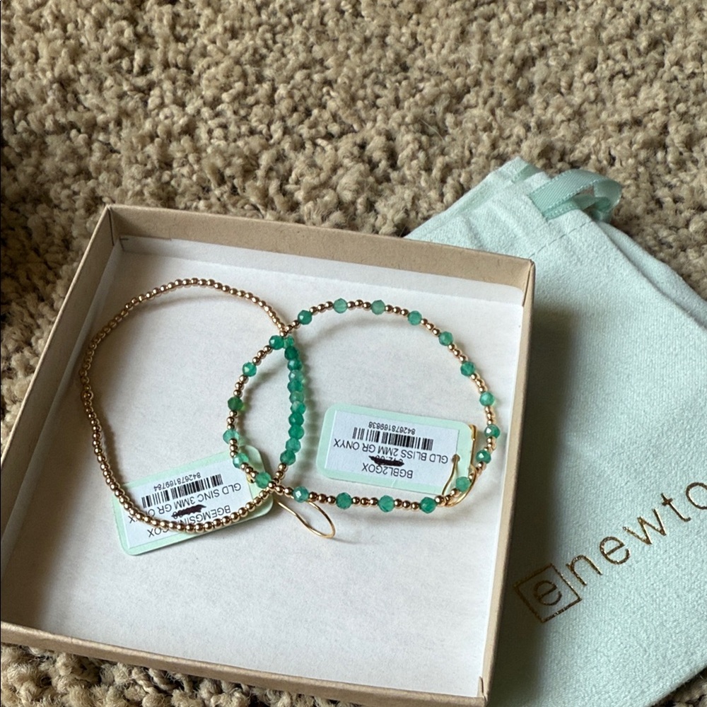 Pair (2) eNewton bracelets New with tags and bag.